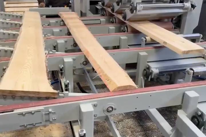 High-precision laser-guided ripping saw in action, ensuring accurate wood cutting and optimized material usage for modern woodworking production.